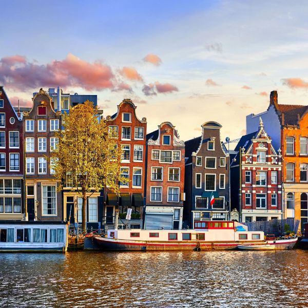 Amsterdam's gabled canal houses reflected in the water