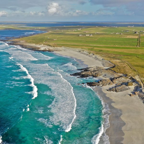 Turquoise sea and sweeping coastal scenery in northern Scotland