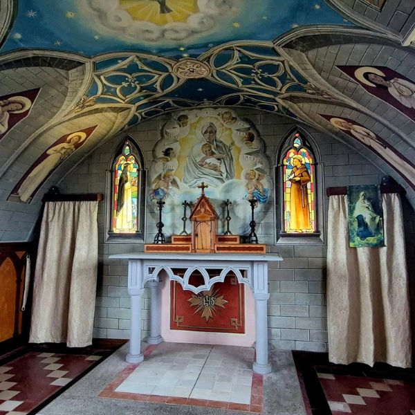 The painted interior and altar of the Italian Chapel