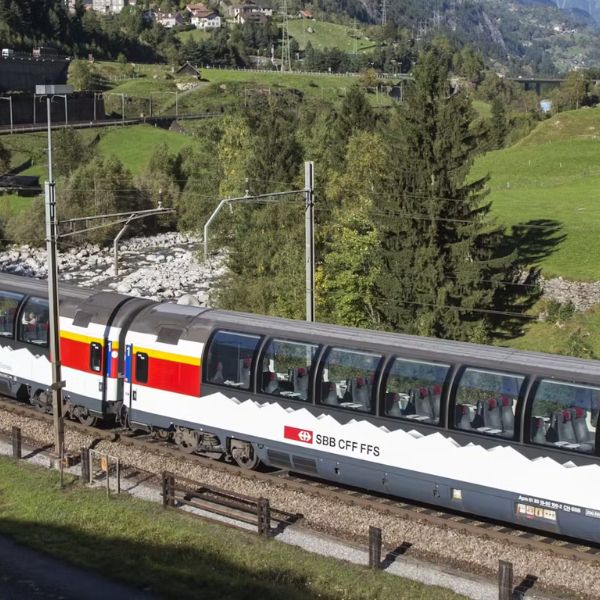 A Swiss panoramic train travelling through mountain scenery