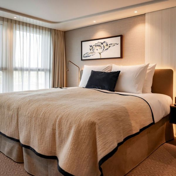 Illustrative cabin interior aboard The Nobleman with contemporary furnishings