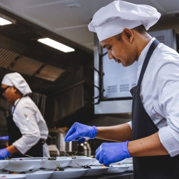 The Nobleman's chefs preparing dishes in the ship's galley