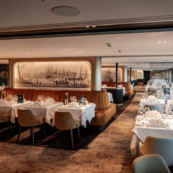 Elegant tables and panoramic windows in The Nobleman's main restaurant