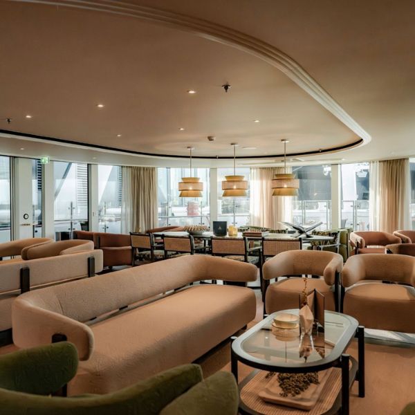 Comfortable seating beside panoramic windows in The Nobleman's lounge
