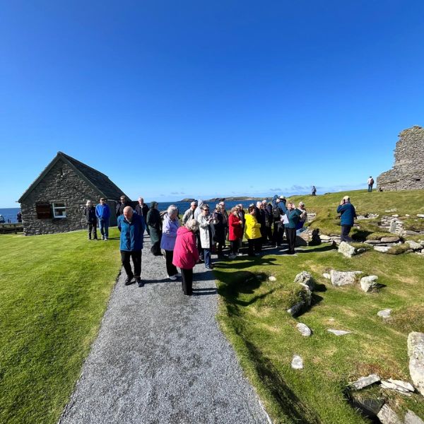 Loch Lomond Travel guests exploring historic buildings in Shetland